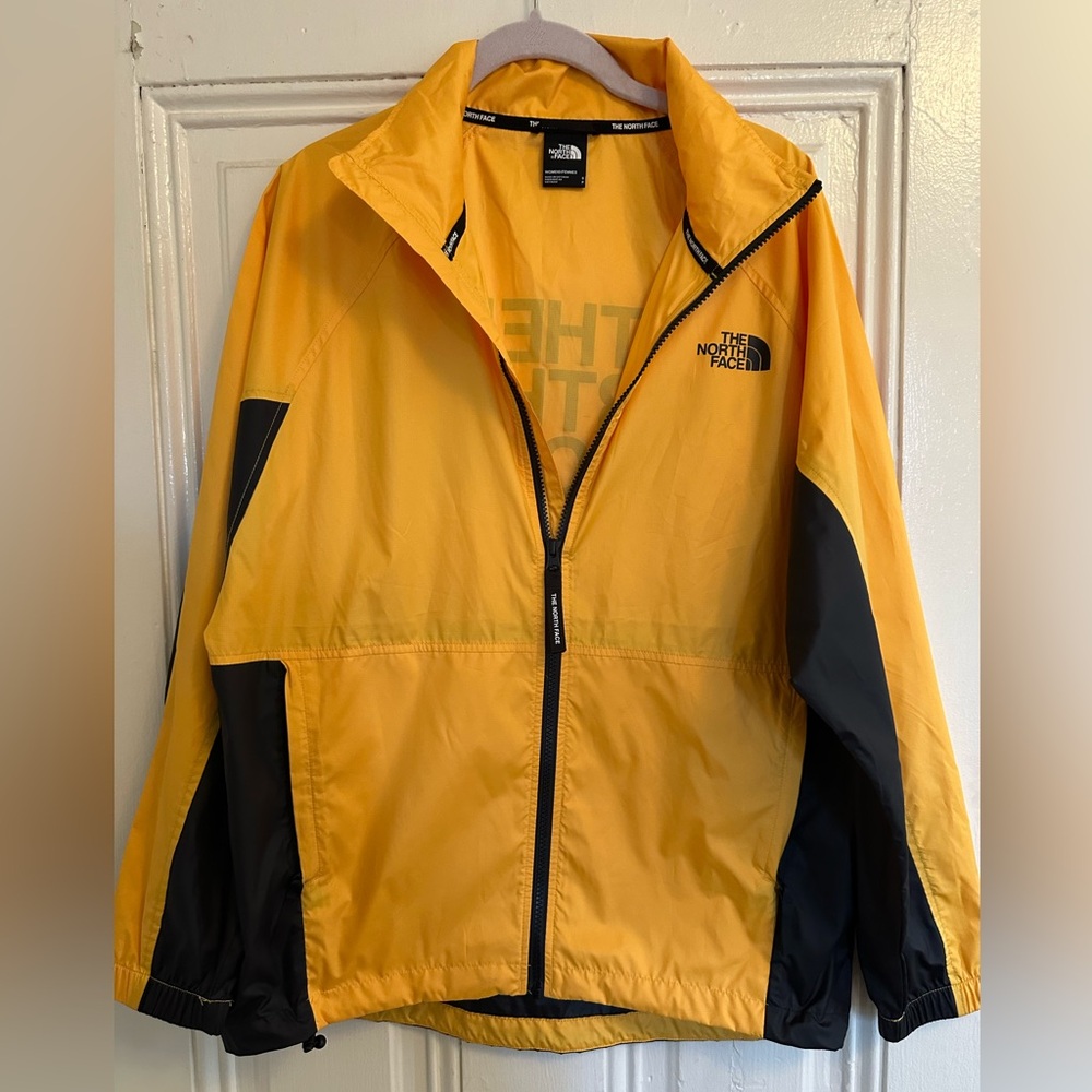 The North Face women’s Vibrant Yellow and Black Windbreaker size small nwot